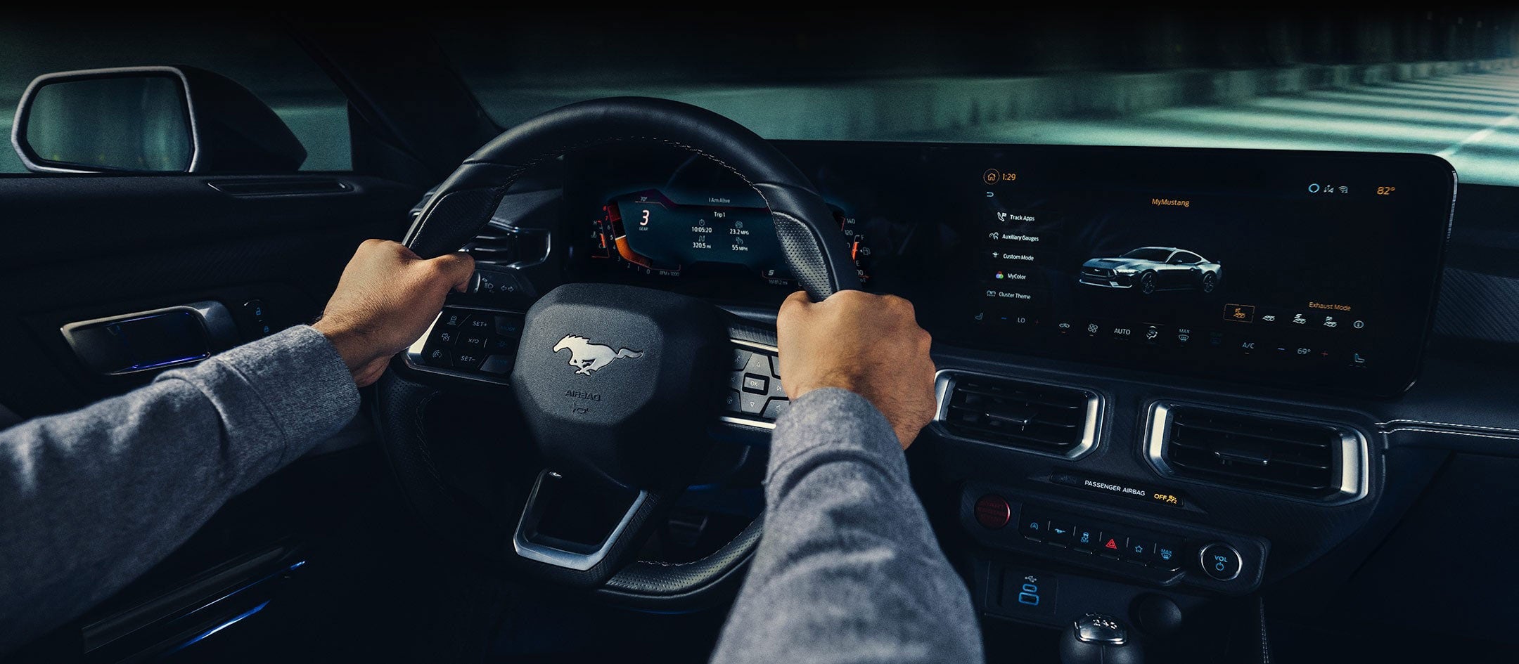 A 2024 Ford Mustang® model interior with a person driving | Warrensburg Ford in Warrensburg MO